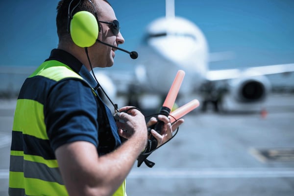 Airport worker managing runway
